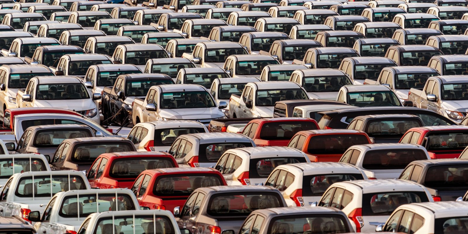 Row of new cars in port.