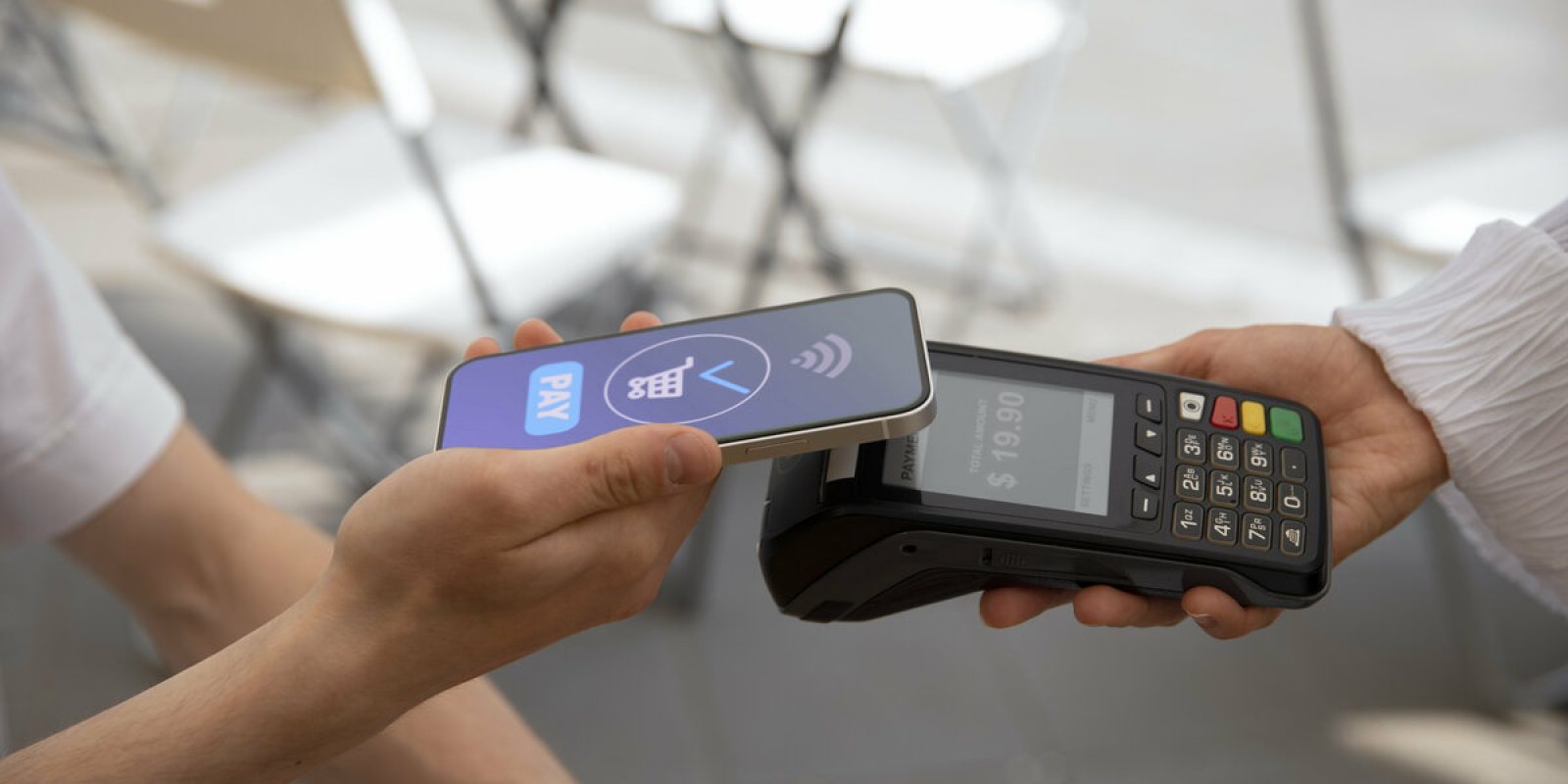 side-view-customer-paying-with-nfc-device